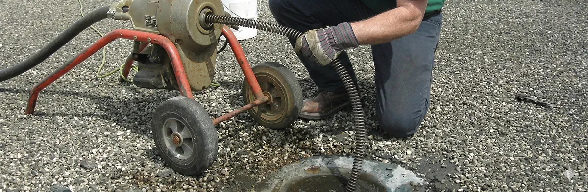 sewer rodding technician actively removing blockages from a sewer line in Milwaukee, WI